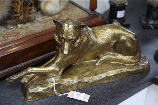 L. Riche. A gold patinated bronze model of a seated Alsatian, 21in.